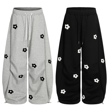 Flower embroidery curved knife sweatpants for men and women