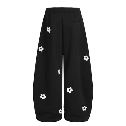 Flower embroidery curved knife sweatpants for men and women